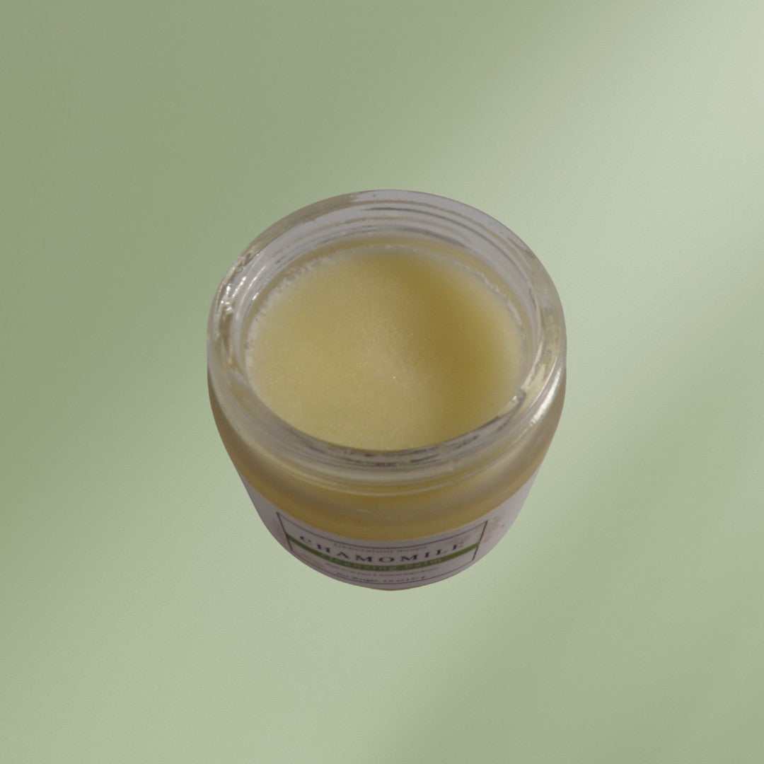 Jar of chamomile cleansing balm with avocado oil for gentle moisturizing and makeup removal