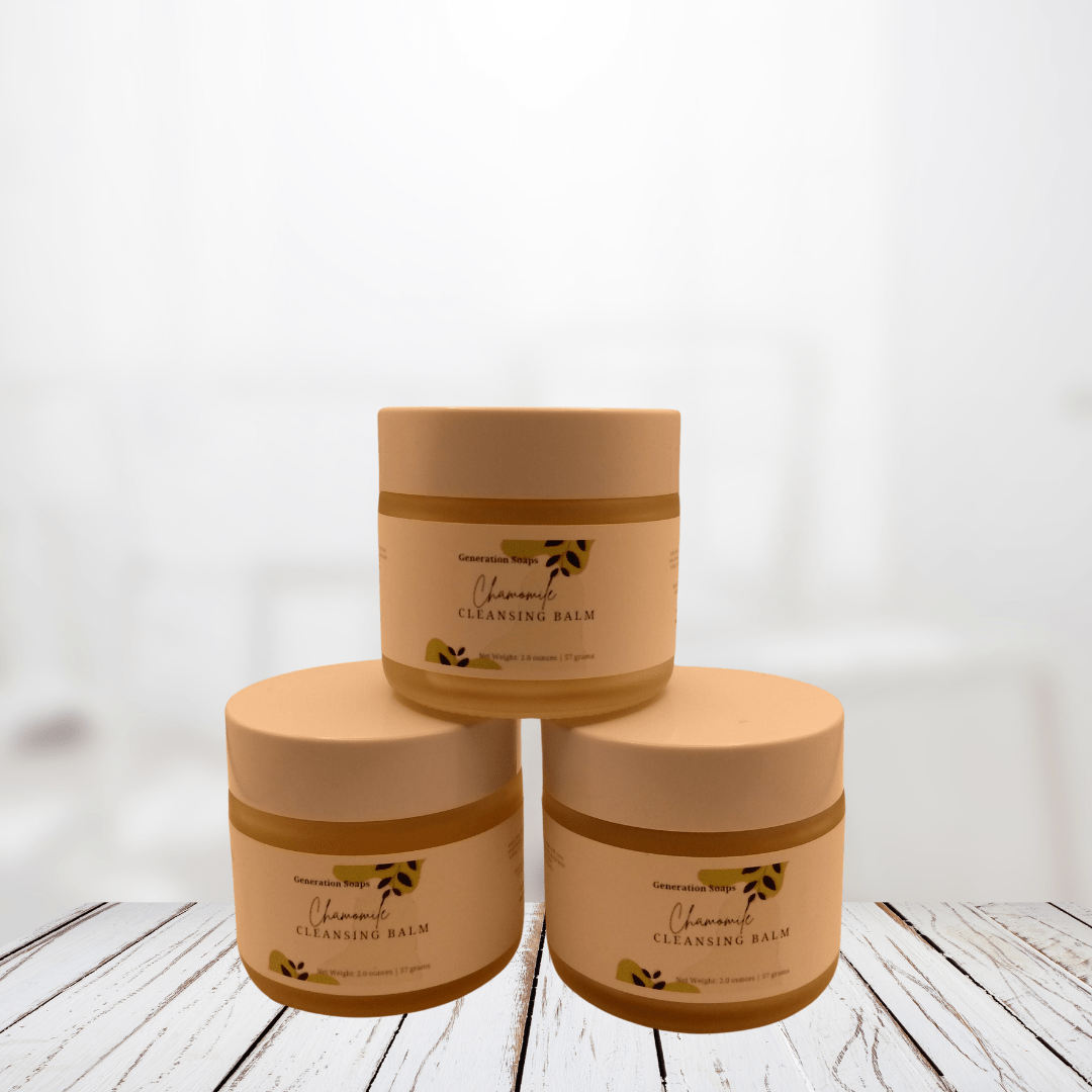 Chamomile Cleansing Balm jars displayed on a wooden surface.