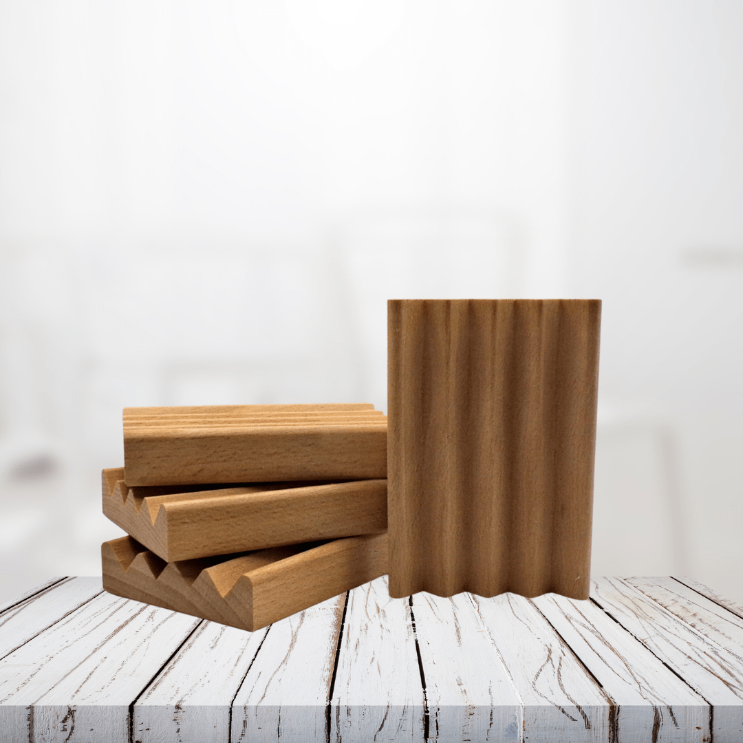 Natural wood soap dish on rustic white surface, ideal for keeping soap dry.