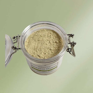 Jar of nourishing rhassoul face mask with natural ingredients for hydrating and restoring skin