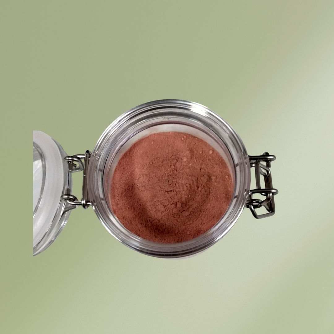 Pink clay and botanical flowers face mask powder with floral ingredients for soothing and clarifying skin care