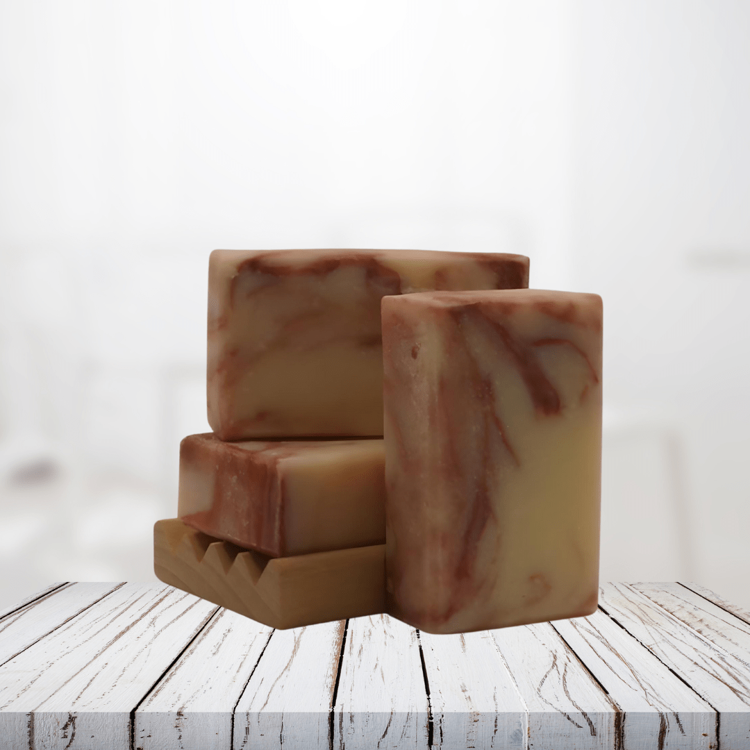 Natural Soap: Radiant Rosehip bars on a wooden surface, featuring a creamy texture with herbal-infused rosehip swirls for glowing skin.