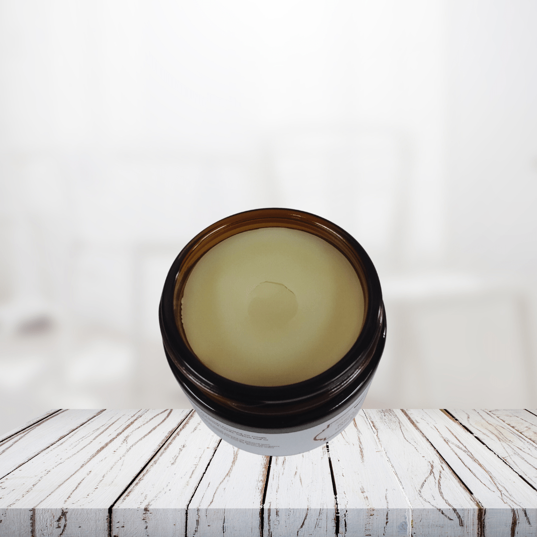 Rugged Citrus Hand Balm for Men in jar packaging on a wooden surface.