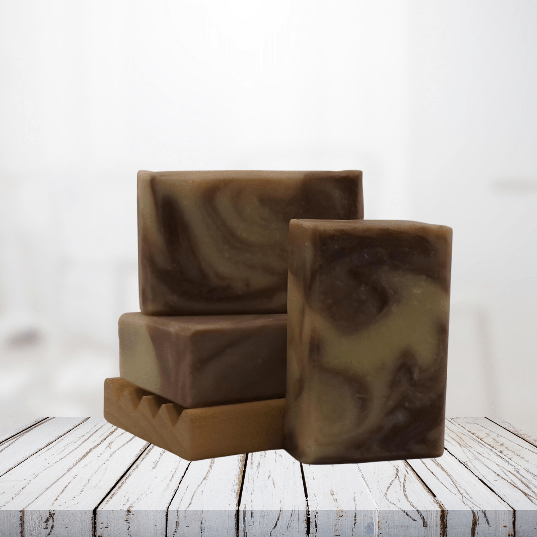 Natural soap bars with swirls, infused with spring herbs and flowers, on a wooden surface.