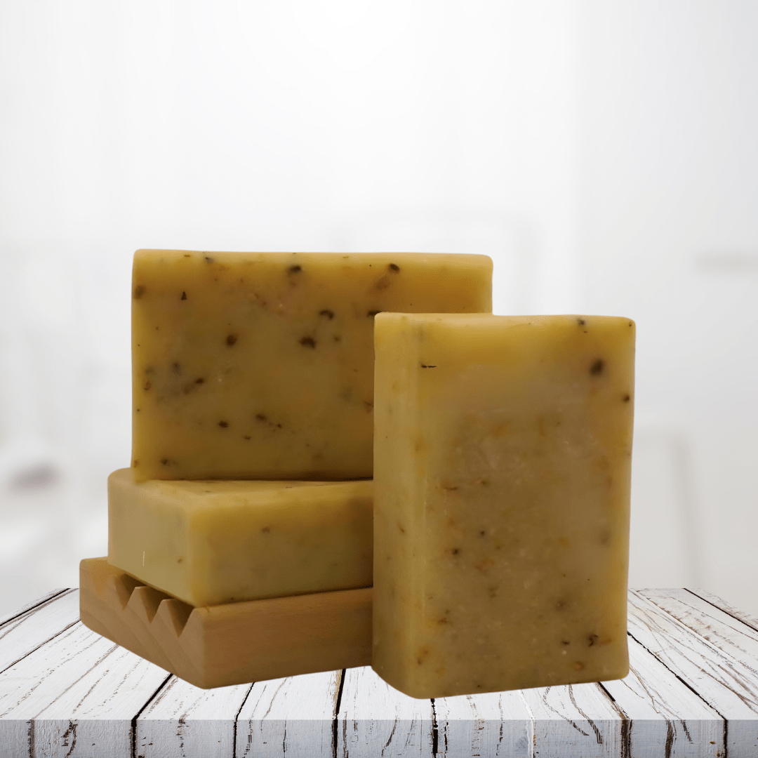 Natural soap bars with sweet orange and calendula, shown on a rustic wooden surface, highlighting their gentle and nourishing qualities.