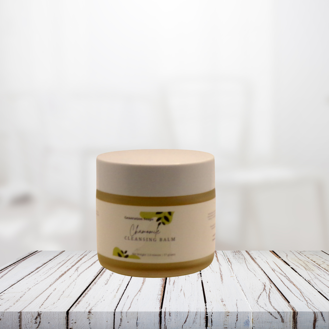 Chamomile Cleansing Balm in a jar on a rustic wooden surface, promoting gentle makeup removal and skin nourishment.