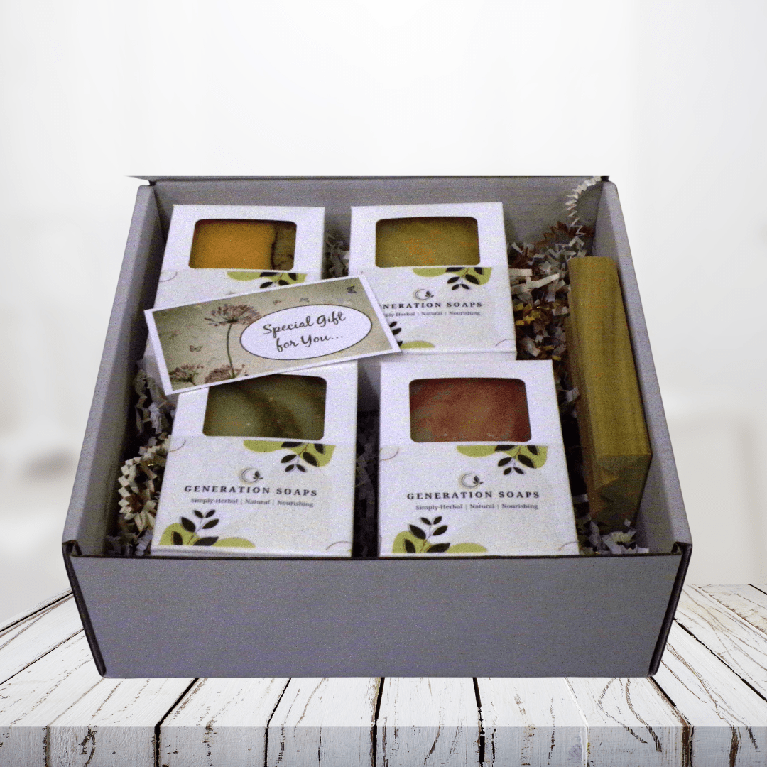 Blossom and Bloom Soap Collection with herbal-infused bars on a natural wood soap dish.