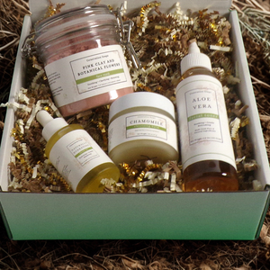 Healthy Glow Herbal Skincare gift set with pink clay mask, chamomile balm, hydrating facial oil, and aloe vera toner