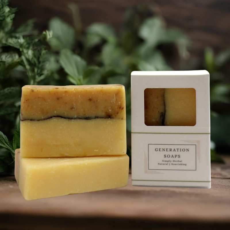 Bar of natural soap with calendula blossoms and packaging box on wooden surface