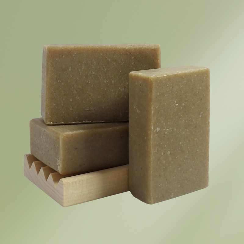 Natural soap bar with oatmeal and nettle ingredients for soothing and moisturizing skin.