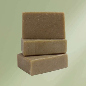 Natural soap bar with oatmeal, nettle, and essential oils for soothing and moisturizing skin
