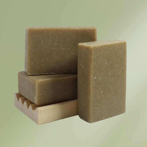 Natural soap bar with oatmeal and nettle ingredients for soothing and moisturizing skin.