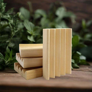 Handcrafted natural wood soap dish with slatted design for proper drainage and extended soap life